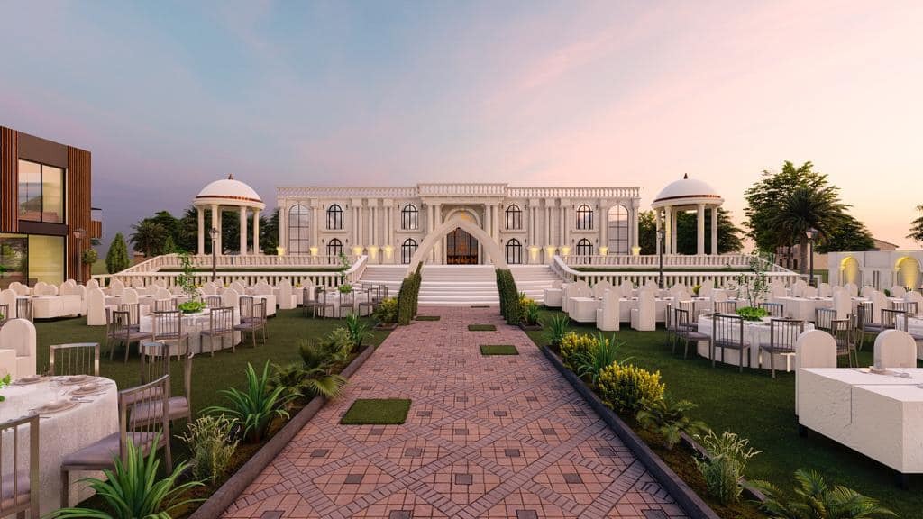 Outdoor wedding lawn at Green Apple Farm House Sialkot with greenery, floral décor, and daytime event setup.