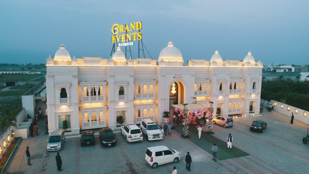 Mid-budget wedding venue setup at Grand Events Marquee in Sialkot with elegant lighting and seating.